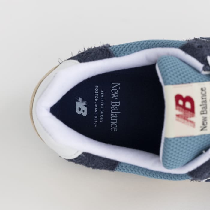 View of blue and white New Balance shoe insole.